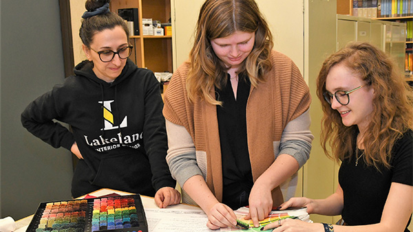 Rochelle helping students in the design studio