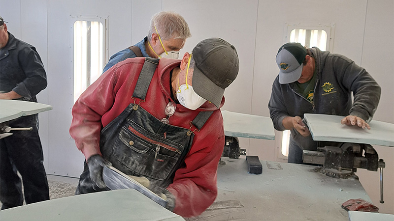 Students working in the garage