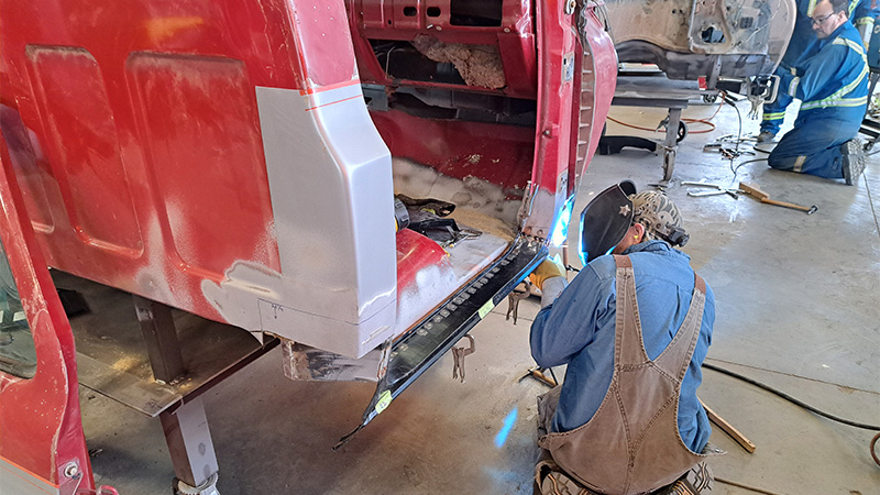 Students working in the garage