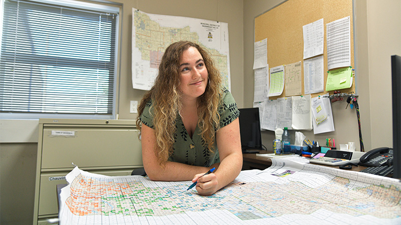 Vanessa Creasy looking through maps