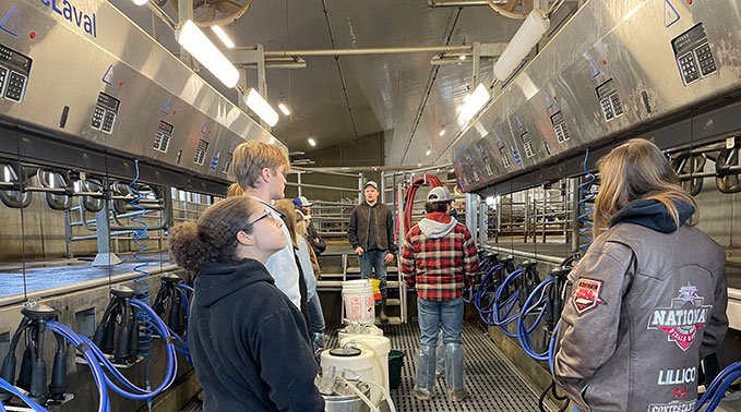 Students in the dairy barn