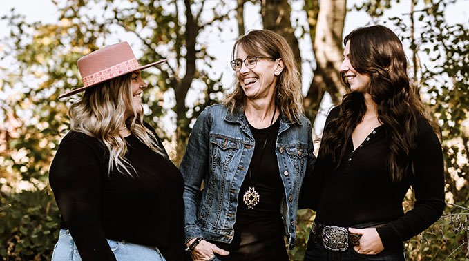 Jordy Howlett, Sheila Howlett and Jacy Spreen share a laugh.
