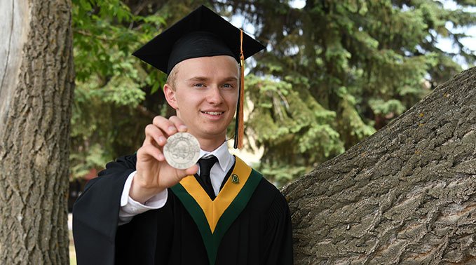 Nathaniel with President's medal