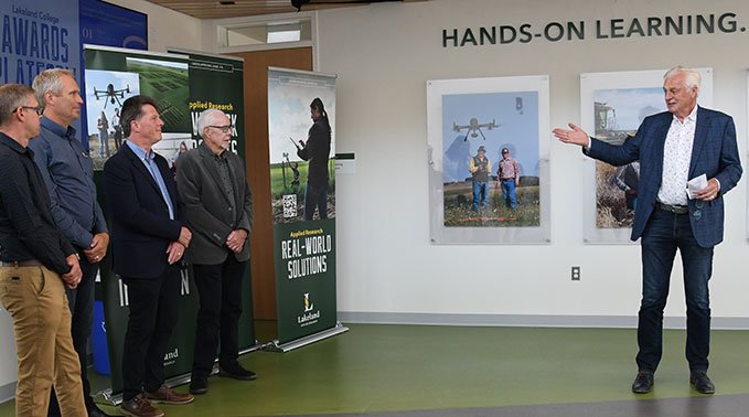 Jerry Bouma presents a gift to Lakeland College from Northlands