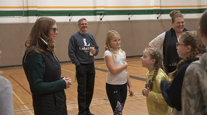 President and CEO Dr. Alice Wainwright Stewart meets with children