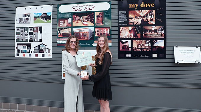 Dr. Alice Wainwright-Stewart, president and CEO of Lakeland College, presents Hannah with the Governor General's award.