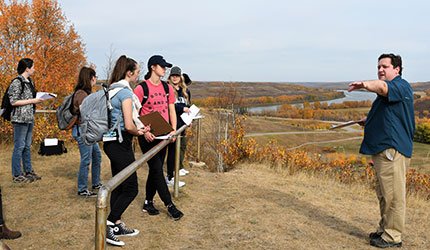 Environmental sciences students in the field with instructor