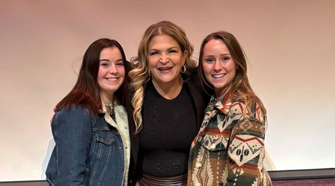nn Hewko (right) with Dr. Jody Carrington (centre) and another classmate (left) at the Wellness Symposium.