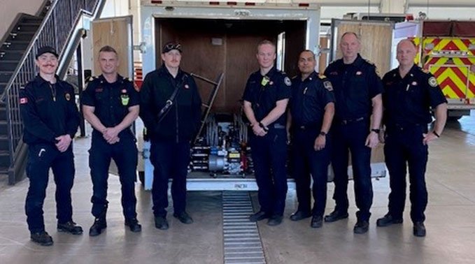 Members of the Emergency Training Centre staff pick up equipment from the Lloydminster Fire Department.