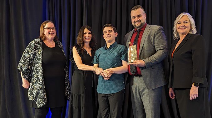 Instructor Brendan Ganton receives his award