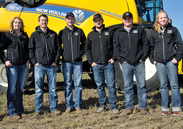 2019 crop research team in front of New Holland combine