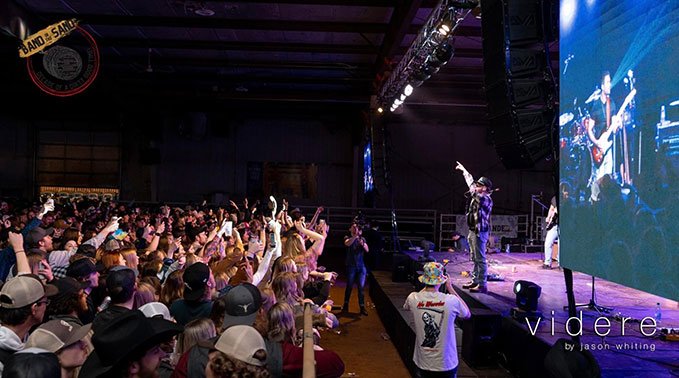 A band performs on stage during Band in the Sand 2023