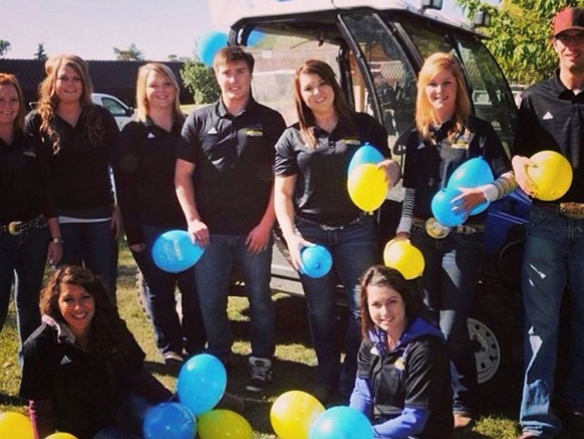 A group of students hold balloons in preparation for the first Band in the Sand 2013