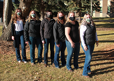Student-Managed Enterprise group gather outside the Vermilion campus.