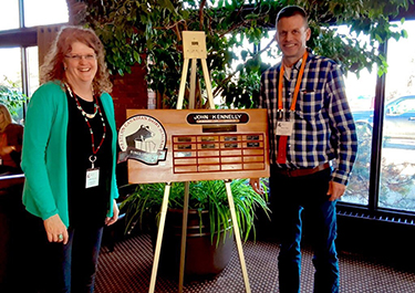 Jsoie Van Lent receiving the John Kennelly award