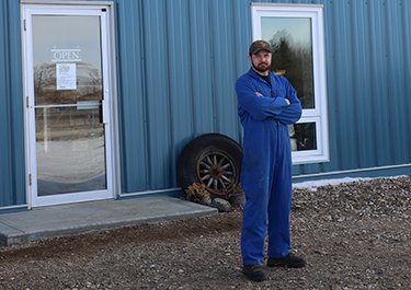 Ryan Baker outside his business in Mannville.