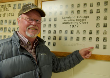 Andy Van Imshoot points out his Class of 1977 photo in Bentley Building