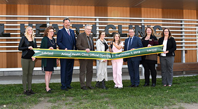 Second-year AHT student cuts the ribbon to open Lakeland College's new Animal Health Clinic 
