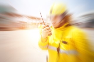 Stylized image of firefighter responding to a radio call