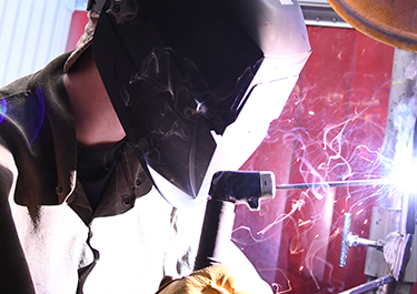 Tyler Manchen welding in class