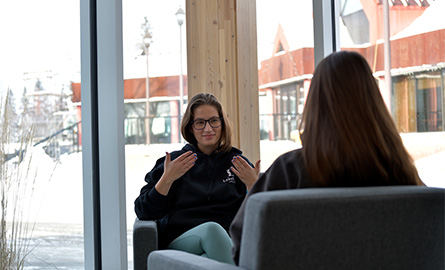 People communicating with ASL in the Mead building