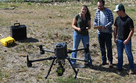 Ag students learning to use a drone over fields
