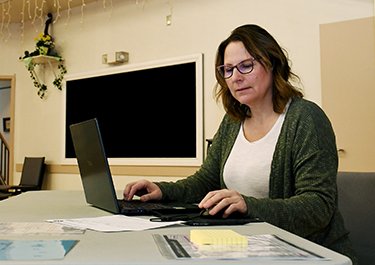 Brenda Carpentier preparing tax returns