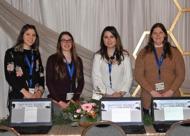 Administrative professional students acted as co-hosts at the conference and helped attendees fill out online surveys