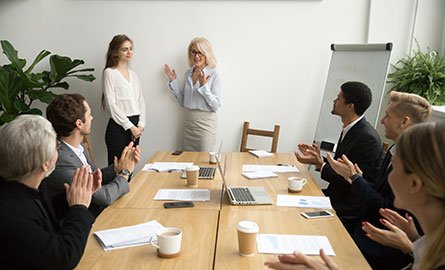 Business student being welcomed into new workplace