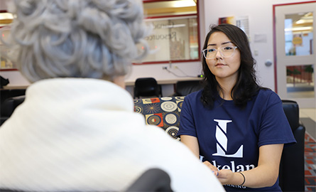 Lakeland student providing listening to community member