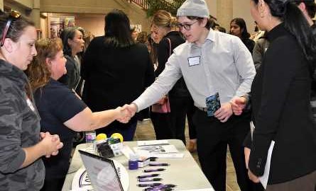 student shaking hands at Chamber Connect