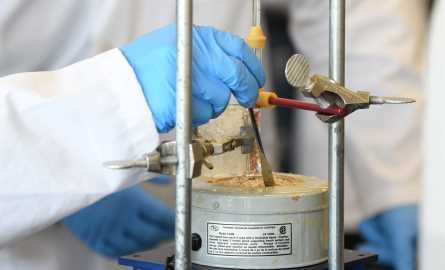 student working on an alcohol to alkene experiment