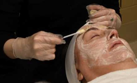 clinical esthetician student doing chemical peel