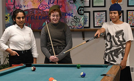 Children playing pool at a youth centre