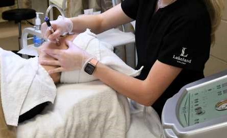 clinicial esthetician student using laser