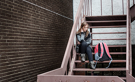 Girl sitting on stairs