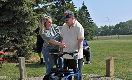 Student helping in a park