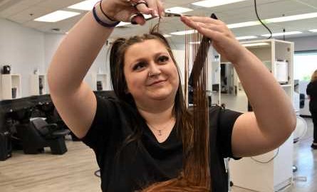 student stylist cutting hair