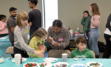 Students working with an elementary class