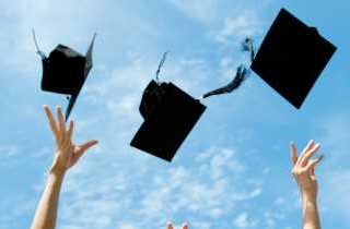 Grad caps thrown into the air