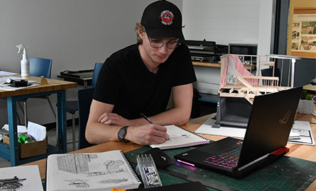 Interior design student drafting plans