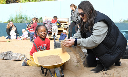 educational assistant student works with a young student