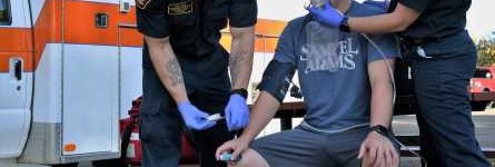 person being worked on by paramedics