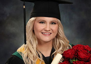 Amanda Noice wearing graduation uniform