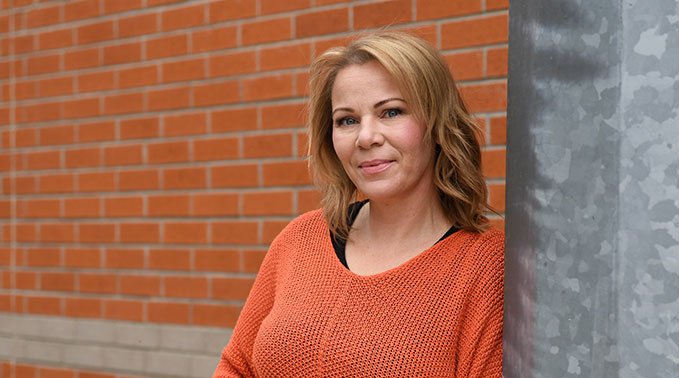 A more relaxed Annette Donnenworth out of doors on the Lloydminster campus.