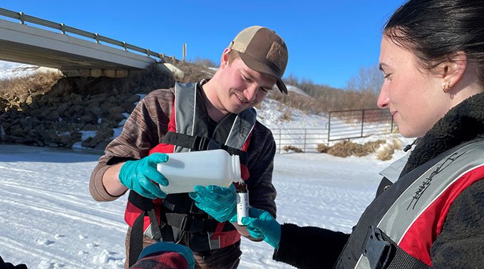 Students taking water samples