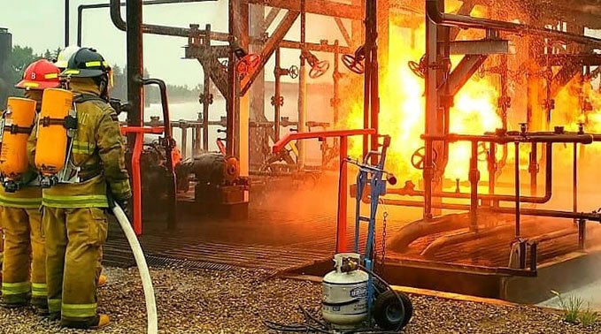 Firefighter students participate in a scenerio at Lakeland College's Emergency Training Centre grounds.