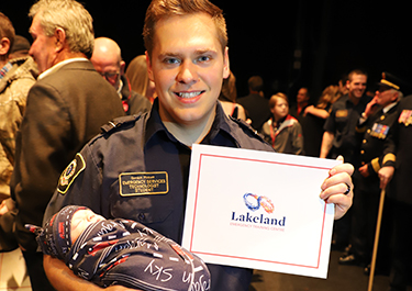 Jamie Pickett at the EST recognition ceremony with his new baby