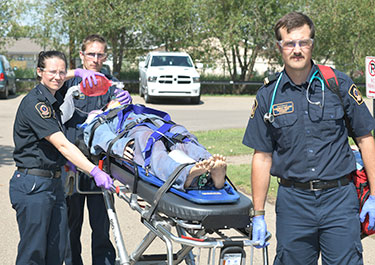 Emergency services technology students in the medical stream complete a transportation exercise.