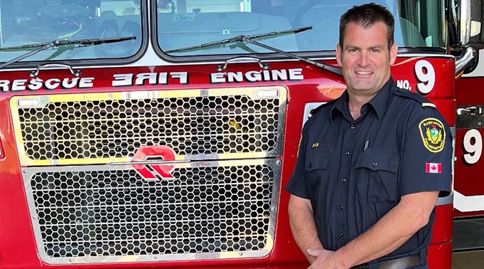 Scott in front of firetruck